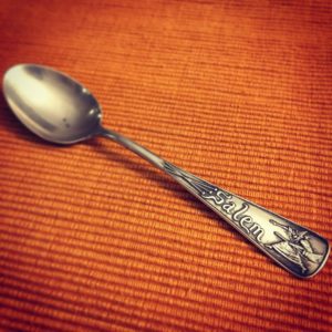 Small spoon with the word Salem and the depiction of a witch on the handle.